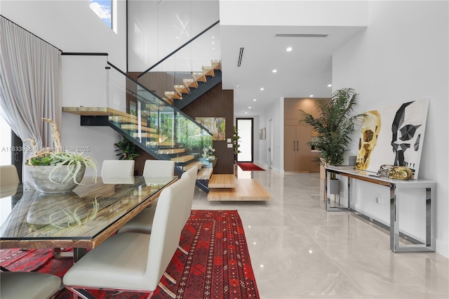 436 NE 10th Ave, Fort Lauderdale, FL 33301 - entrance foyer featuring marble tiled flooring, stairs, a high ceiling, and recessed lighting