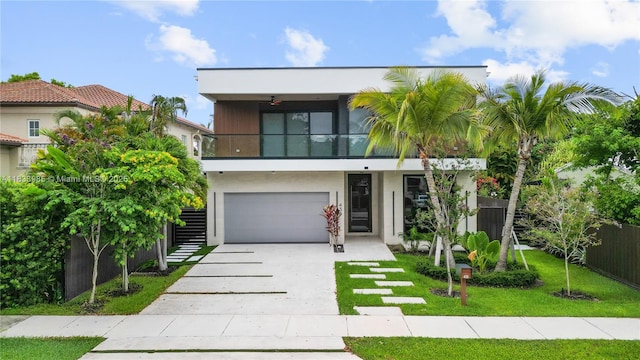 436 NE 10th Ave, Fort Lauderdale, FL 33301 - view of front of house featuring a balcony, stucco siding, an attached garage, and concrete driveway