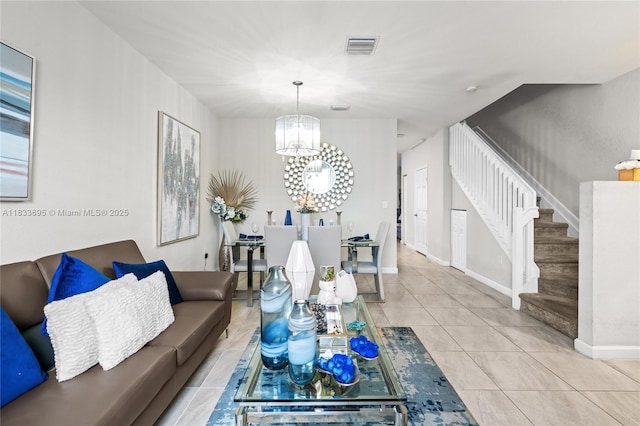 10468 W 33rd Ln, Hialeah, FL 33018 - tiled living area with a chandelier and stairs