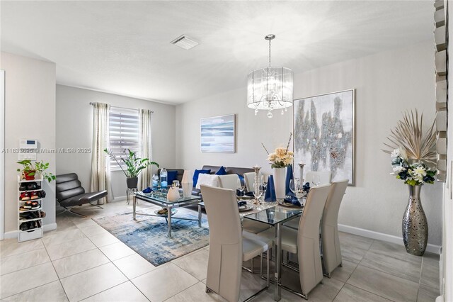 10468 W 33rd Ln, Hialeah, FL 33018 - dining room featuring a chandelier and light tile patterned floors