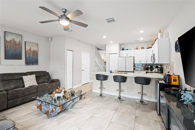 10468 W 33rd Ln, Hialeah, FL 33018 - living room featuring a ceiling fan, light tile patterned floors, and recessed lighting