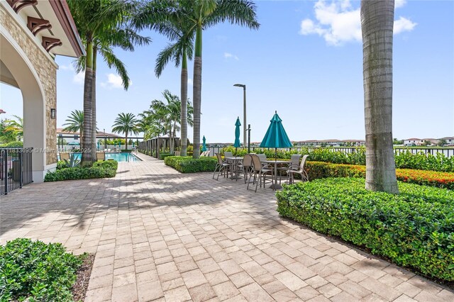 10468 W 33rd Ln, Hialeah, FL 33018 - view of property's community featuring a swimming pool and a patio