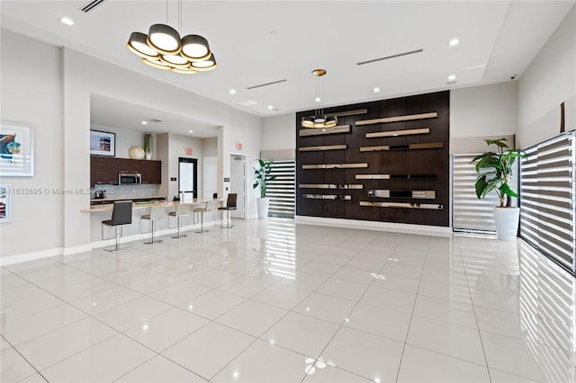 10468 W 33rd Ln, Hialeah, FL 33018 - living area with light tile patterned floors and baseboards
