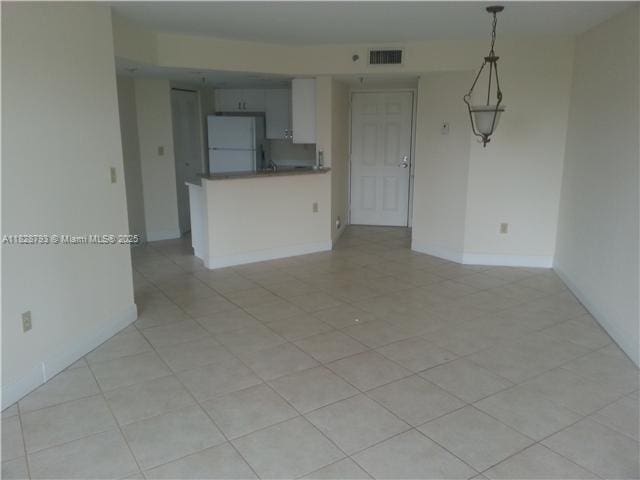 2351 Douglas Rd Unit 505, Miami, FL 33145 - unfurnished living room featuring light tile patterned flooring