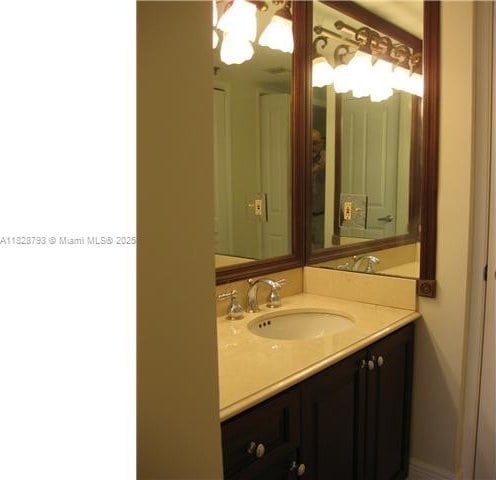 2351 Douglas Rd Unit 505, Miami, FL 33145 - bathroom with vanity and a chandelier