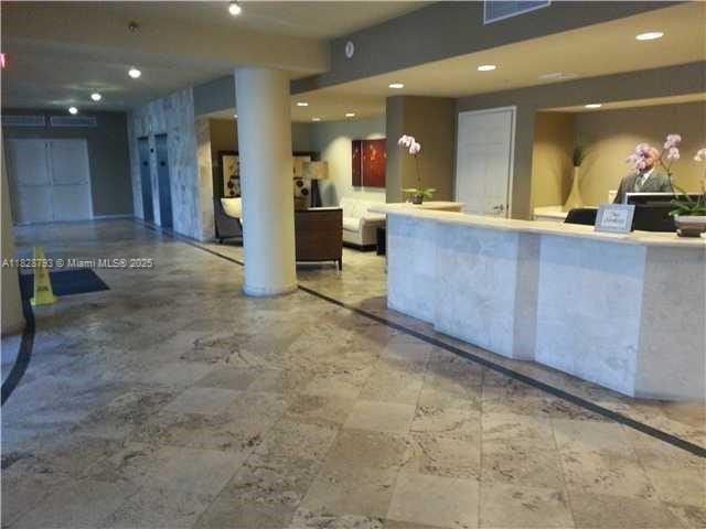 2351 Douglas Rd Unit 505, Miami, FL 33145 - reception area with recessed lighting