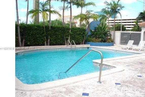 2351 Douglas Rd Unit 505, Miami, FL 33145 - community pool with a patio