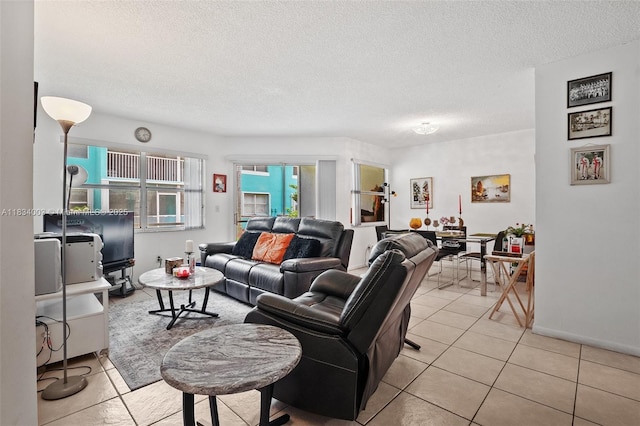 2657 SE 19th Ct Unit 103-E, Homestead, FL 33035 - living area featuring light tile patterned floors and a textured ceiling