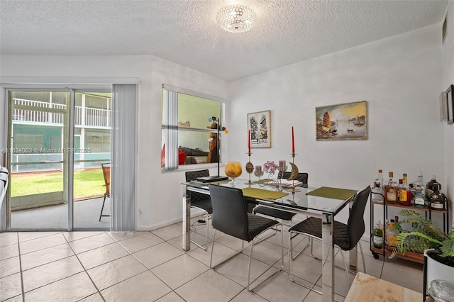 2657 SE 19th Ct Unit 103-E, Homestead, FL 33035 - dining room featuring a textured ceiling and light tile patterned flooring