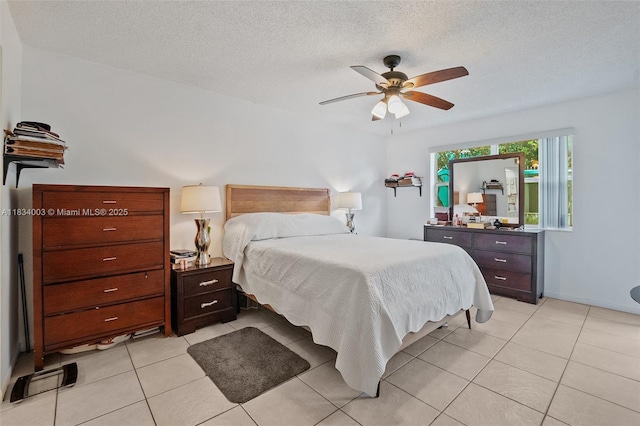 2657 SE 19th Ct Unit 103-E, Homestead, FL 33035 - bedroom featuring light tile patterned floors, ceiling fan, and a textured ceiling