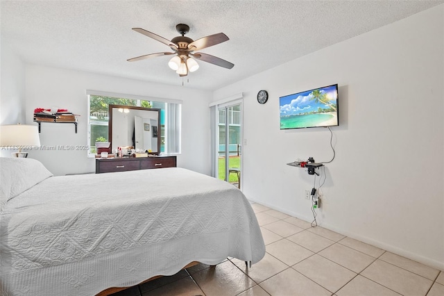 2657 SE 19th Ct Unit 103-E, Homestead, FL 33035 - bedroom featuring access to outside, light tile patterned flooring, ceiling fan, and a textured ceiling