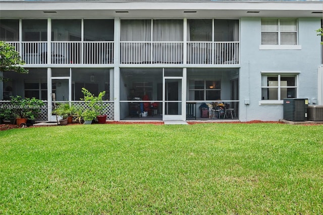 2657 SE 19th Ct Unit 103-E, Homestead, FL 33035 - rear view of house featuring a yard and stucco siding