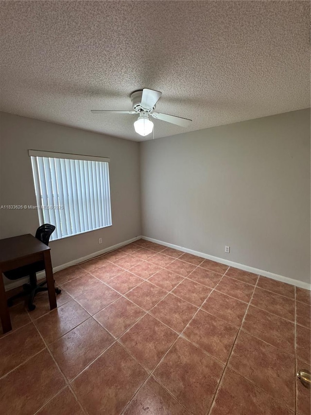 4907 SW 32nd Way, Hollywood, FL 33312 - tiled spare room featuring a ceiling fan and a textured ceiling