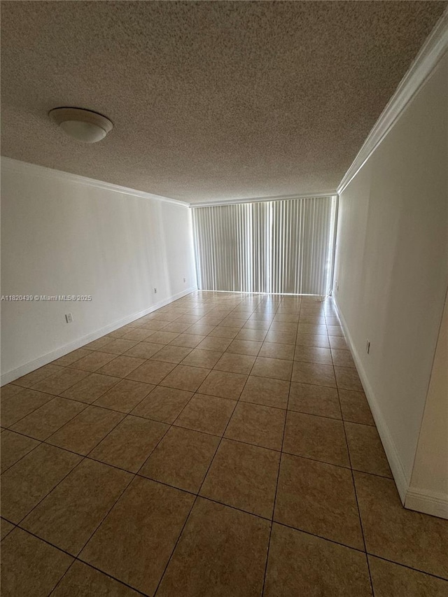 10875 SW 112th Ave Unit 206, Miami, FL 33176 - spare room featuring a textured ceiling, crown molding, and tile patterned flooring