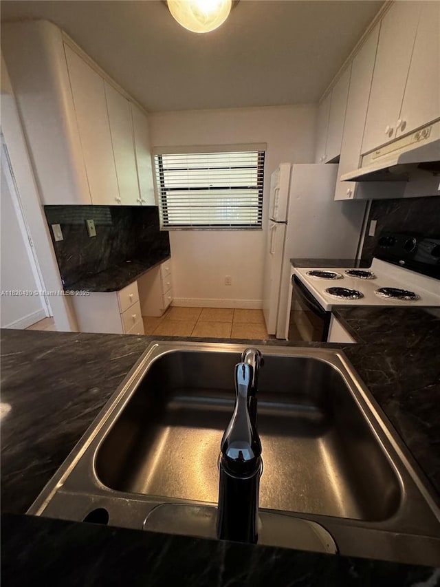 10875 SW 112th Ave Unit 206, Miami, FL 33176 - kitchen with under cabinet range hood, white cabinets, electric stove, and dark countertops