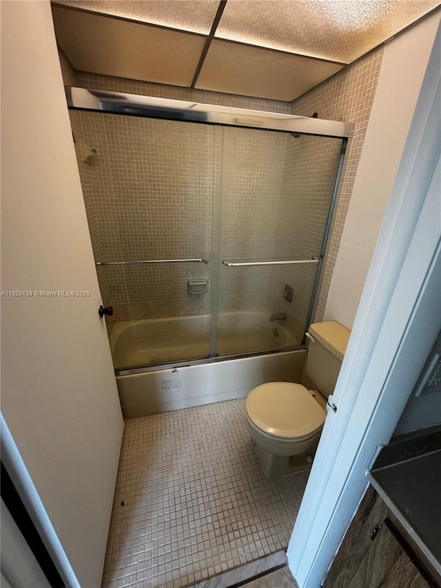 10875 SW 112th Ave Unit 206, Miami, FL 33176 - full bathroom featuring bath / shower combo with glass door and tile patterned flooring
