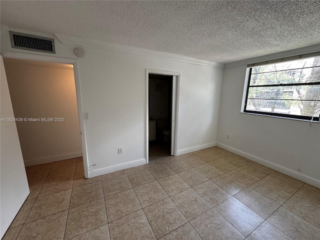 10875 SW 112th Ave Unit 206, Miami, FL 33176 - unfurnished bedroom featuring a textured ceiling, light tile patterned floors, and crown molding