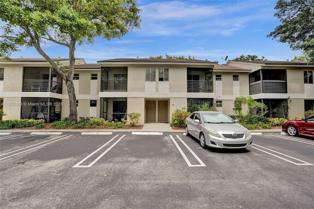 303 Gardens Dr Unit 203, Pompano Beach, FL 33069 - view of property with uncovered parking