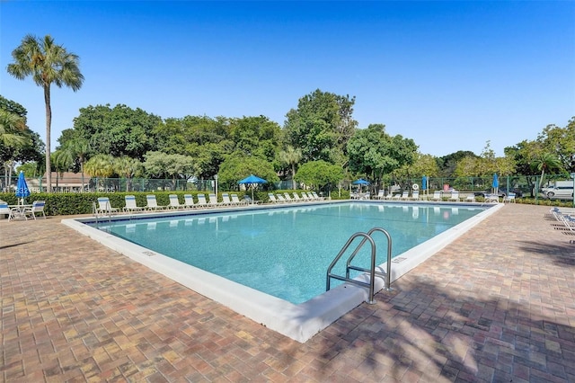 303 Gardens Dr Unit 203, Pompano Beach, FL 33069 - community pool featuring a patio area