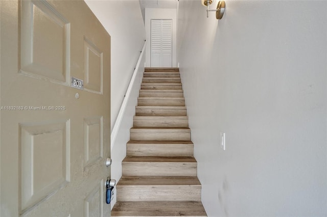 303 Gardens Dr Unit 203, Pompano Beach, FL 33069 - stairway with wood finished floors
