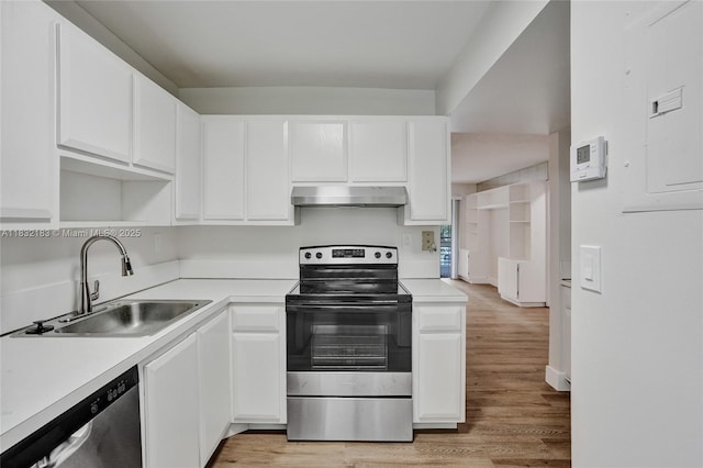 303 Gardens Dr Unit 203, Pompano Beach, FL 33069 - kitchen with appliances with stainless steel finishes, under cabinet range hood, white cabinets, and light countertops