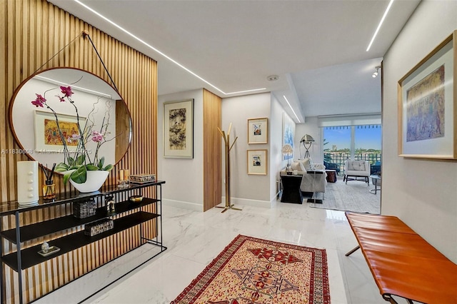 2 Grove Isle Dr Unit B410, Miami, FL 33133 - hallway featuring marble finish flooring and baseboards