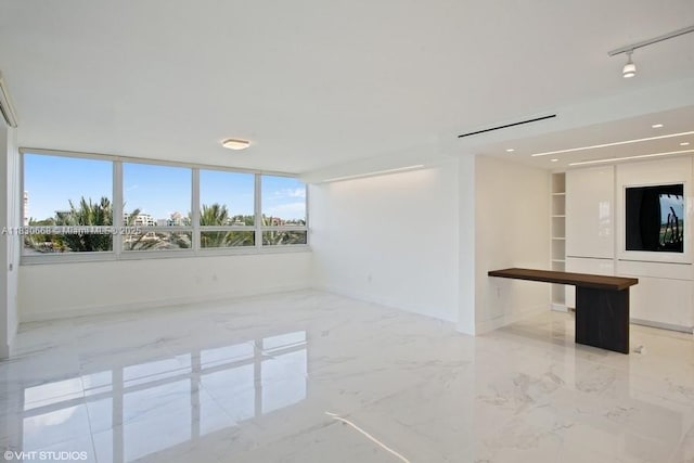 2 Grove Isle Dr Unit B410, Miami, FL 33133 - spare room featuring light marble finish floors, built in shelves, and recessed lighting