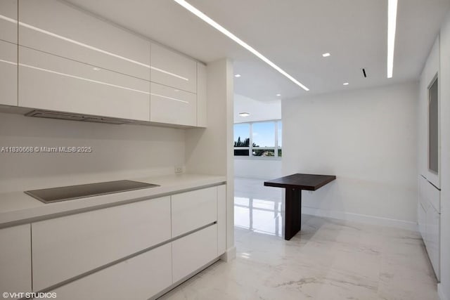 2 Grove Isle Dr Unit B410, Miami, FL 33133 - kitchen featuring white cabinetry, modern cabinets, light marble finish floors, and recessed lighting