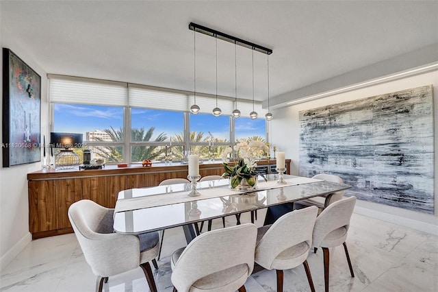 2 Grove Isle Dr Unit B410, Miami, FL 33133 - dining area with marble look tile flooring and baseboards