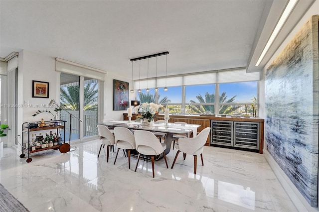 2 Grove Isle Dr Unit B410, Miami, FL 33133 - dining space featuring marble tiled flooring and beverage cooler
