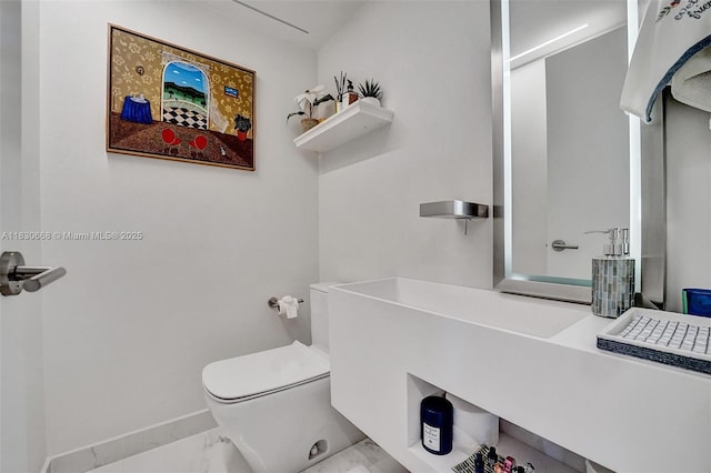 2 Grove Isle Dr Unit B410, Miami, FL 33133 - bathroom featuring marble finish floors and toilet