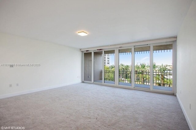 2 Grove Isle Dr Unit B410, Miami, FL 33133 - unfurnished room with carpet flooring and baseboards