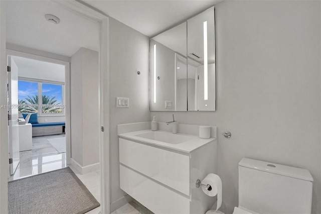 2 Grove Isle Dr Unit B410, Miami, FL 33133 - bathroom with vanity and marble finish flooring