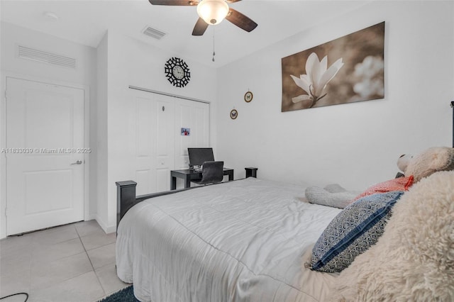 2409 NW 131st Cir, Miami, FL 33167 - bedroom with tile patterned floors, a ceiling fan, and a closet