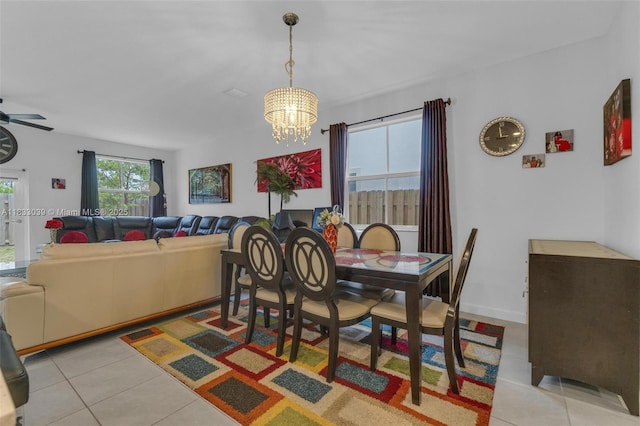 2409 NW 131st Cir, Miami, FL 33167 - dining room featuring light tile patterned floors, a chandelier, and a ceiling fan