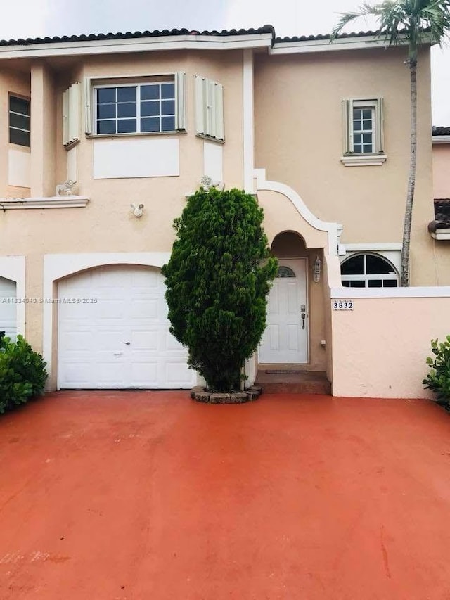 3832 SW 153rd Ct, Miami, FL 33185 - view of front facade with stucco siding, a garage, and driveway
