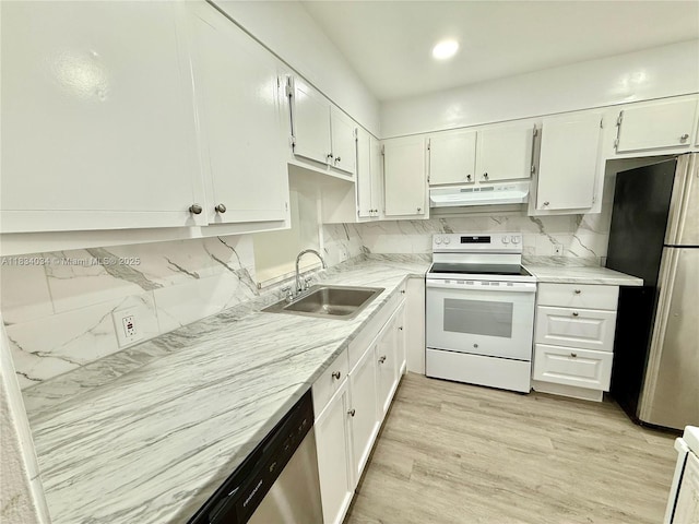11925 NE 2nd Ave Unit B207, North Miami, FL 33161 - kitchen featuring appliances with stainless steel finishes, under cabinet range hood, white cabinets, and recessed lighting