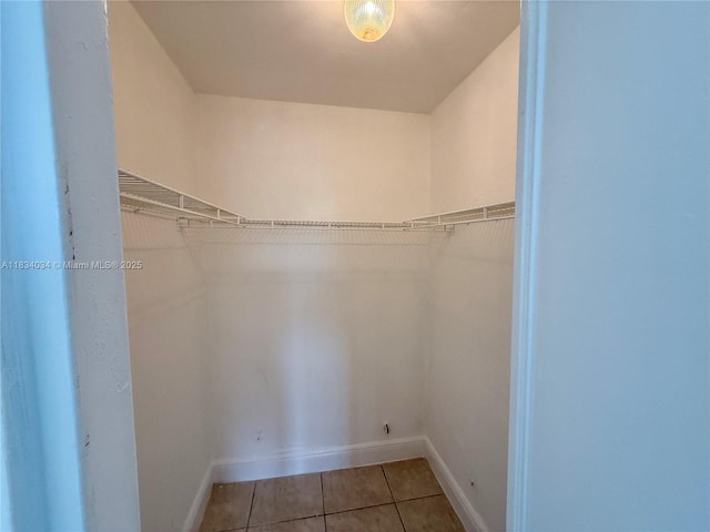 11925 NE 2nd Ave Unit B207, North Miami, FL 33161 - walk in closet featuring tile patterned flooring