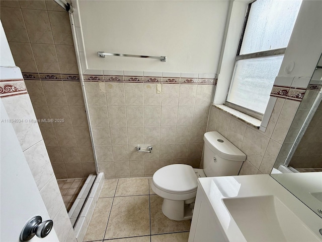 11925 NE 2nd Ave Unit B207, North Miami, FL 33161 - full bathroom featuring tile walls, a stall shower, vanity, tile patterned flooring, and a baseboard heating unit