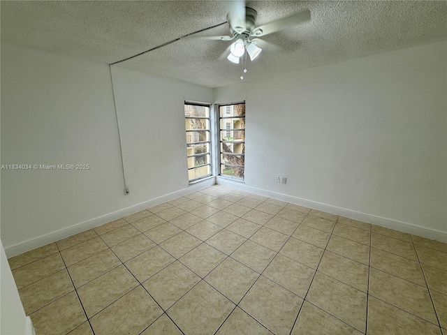 11925 NE 2nd Ave Unit B207, North Miami, FL 33161 - spare room featuring a textured ceiling, a ceiling fan, and light tile patterned floors