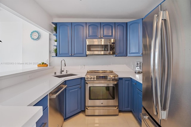 3675 N Country Club Dr Unit 1705, Aventura, FL 33180 - kitchen with appliances with stainless steel finishes, blue cabinetry, open shelves, and light countertops