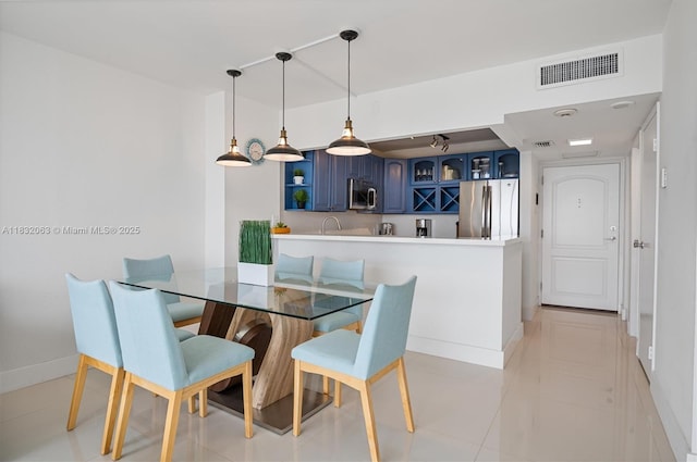3675 N Country Club Dr Unit 1705, Aventura, FL 33180 - dining space featuring baseboards and light tile patterned flooring