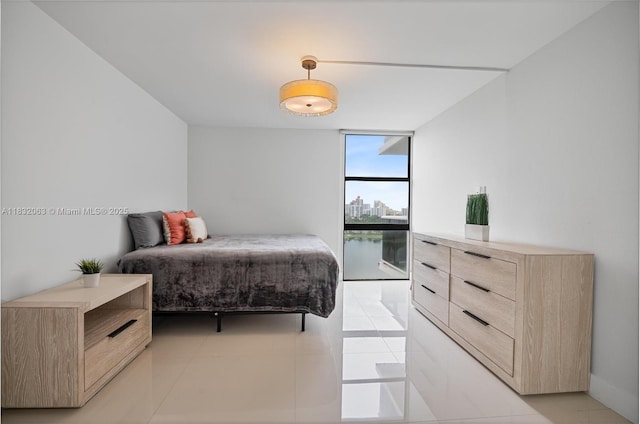 3675 N Country Club Dr Unit 1705, Aventura, FL 33180 - bedroom featuring a wall of windows and light tile patterned floors