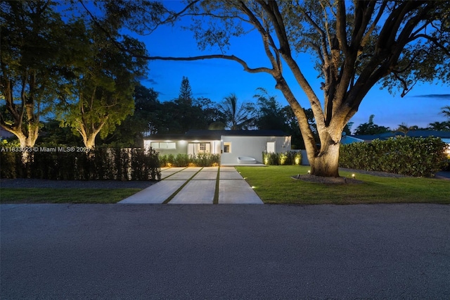 1003 NE 115th St, Biscayne Park, FL 33161 - view of front of home featuring concrete driveway and a front lawn