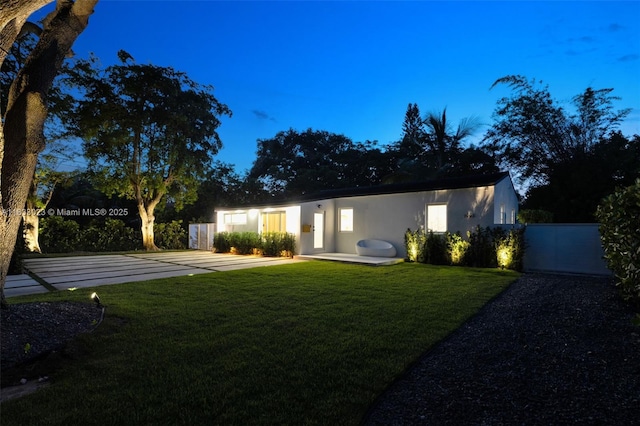 1003 NE 115th St, Biscayne Park, FL 33161 - rear view of house featuring stucco siding