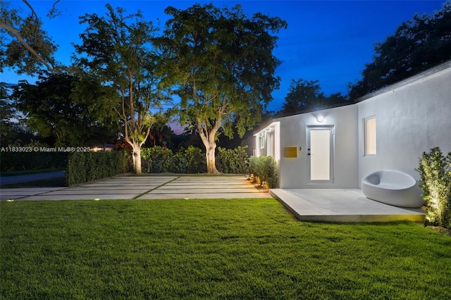 1003 NE 115th St, Biscayne Park, FL 33161 - view of grassy yard featuring a patio area