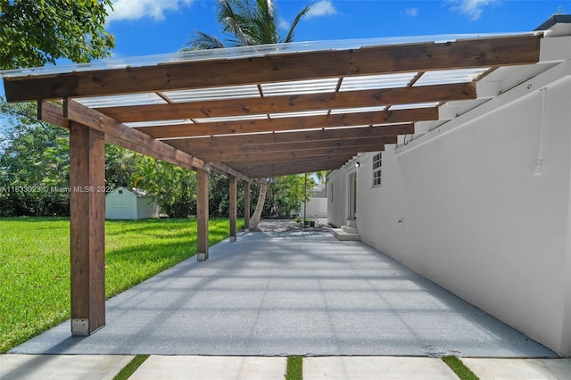1003 NE 115th St, Biscayne Park, FL 33161 - view of parking featuring a storage unit