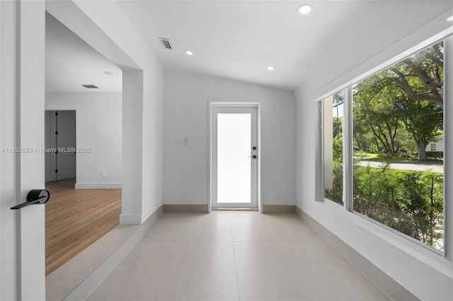 1003 NE 115th St, Biscayne Park, FL 33161 - spare room with light tile patterned floors, recessed lighting, and lofted ceiling
