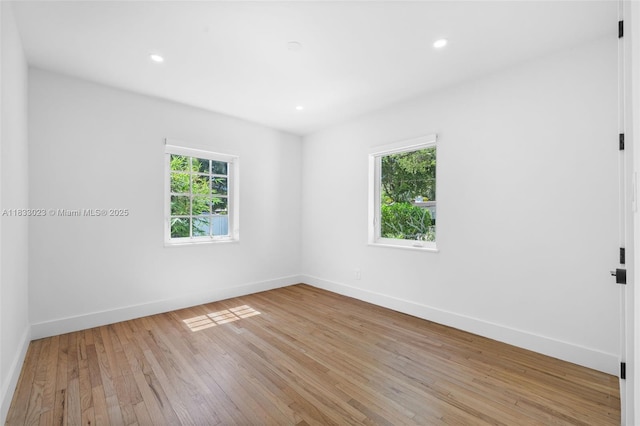 1003 NE 115th St, Biscayne Park, FL 33161 - unfurnished room featuring light wood-style floors and recessed lighting