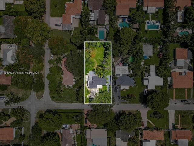 1003 NE 115th St, Biscayne Park, FL 33161 - aerial view of property and surrounding area with property boundaries highlighted and nearby suburban area